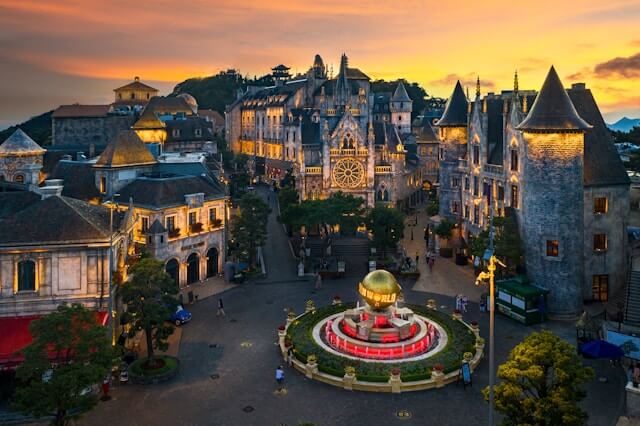 an aerial view of a city with a fountain