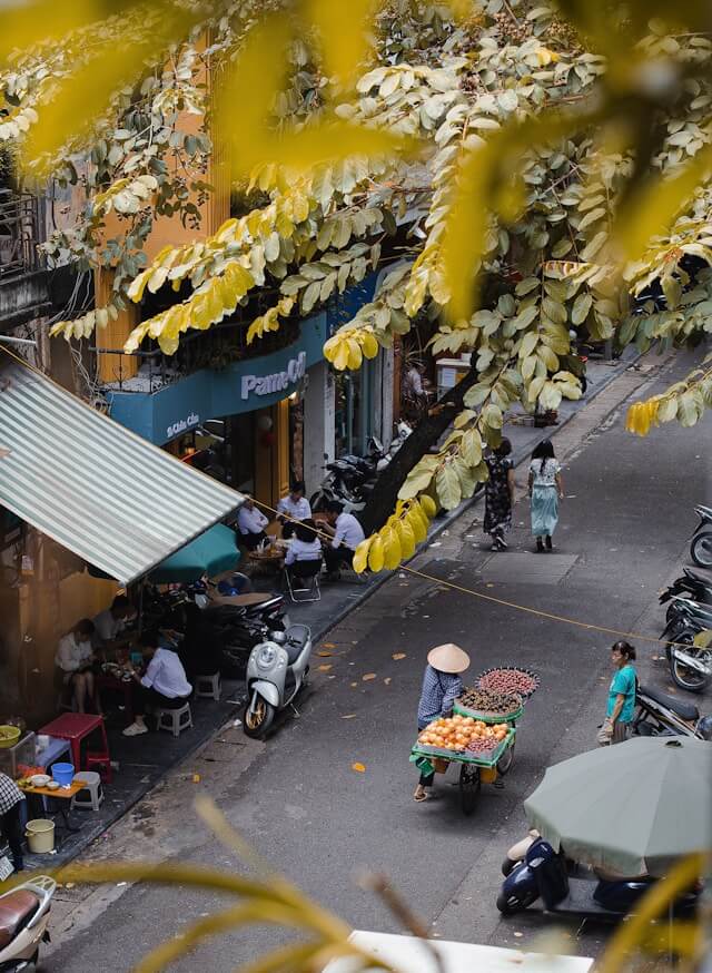 a view of a street in Hanoi from above of a building